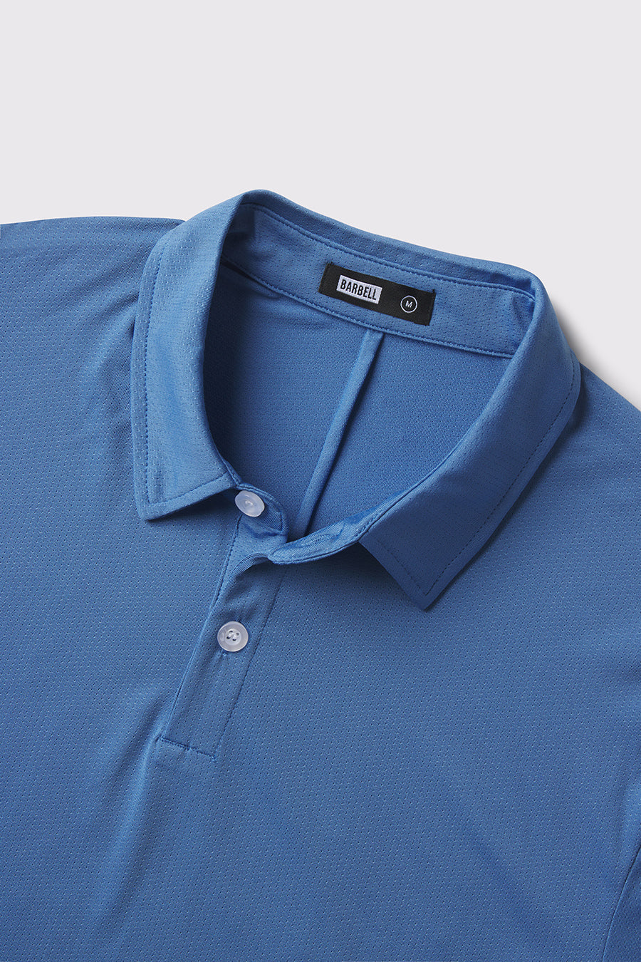 Ultralight Polo -Karlberry Blue - photo from front button detail #color_karlberry-blue