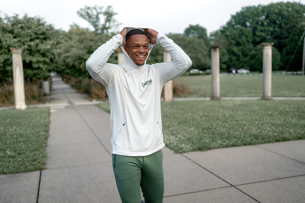 Barbell Hoodie Cream on model outdoors