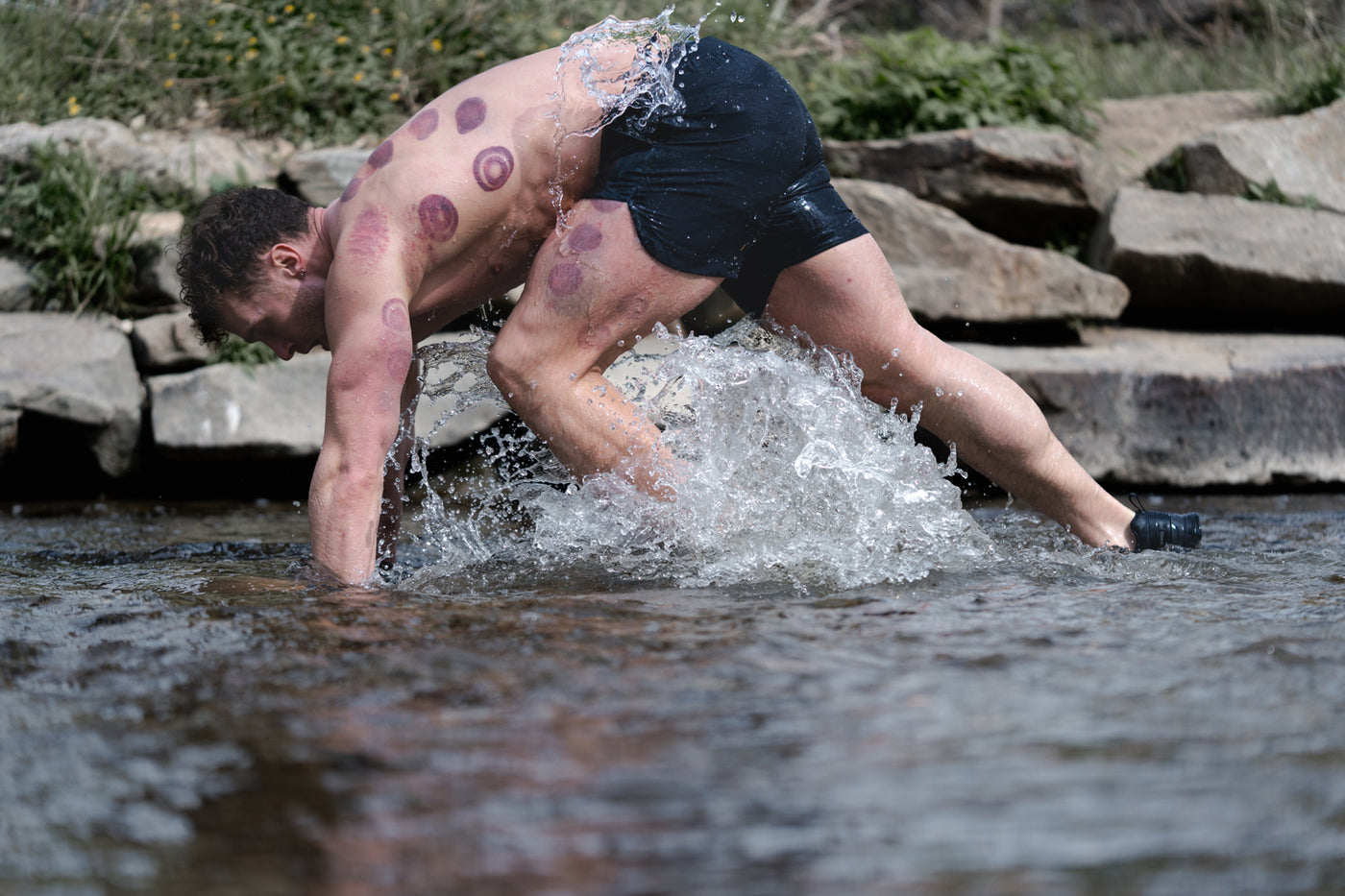 Barbell Model wearing Rapid Hybrid Short in Black camo in Creek