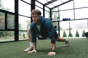 Man stretching barbell hoodie