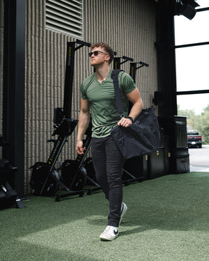 Mens casual wear model wearing Athletic Chinos in Black and a Sage Havok V Neck Tee from Barbell Apparel